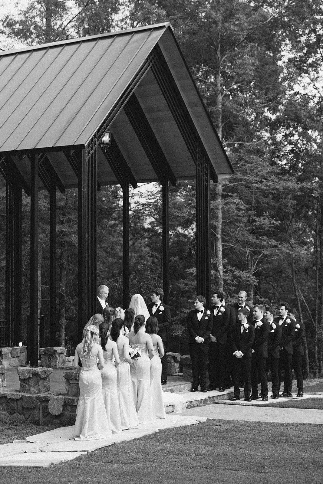 Bridal party at the chapel in black and white