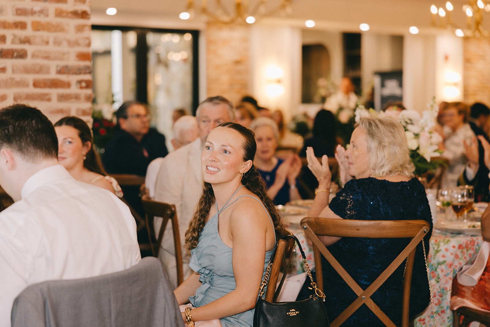 Guests applauding during the reception in the banquet hall